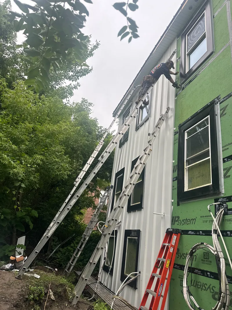 Board-and-batten siding going up