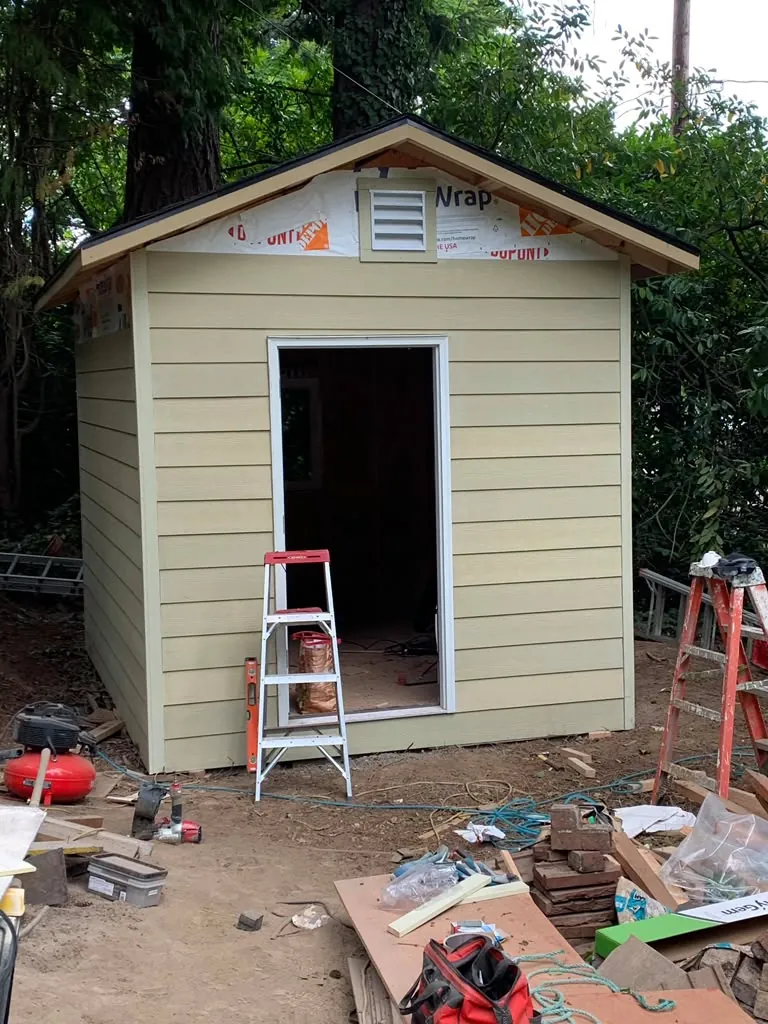 Custom shed — siding and trim finished