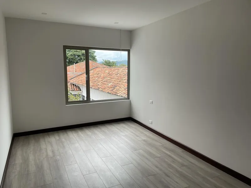 Finished bedroom — new floor and trim