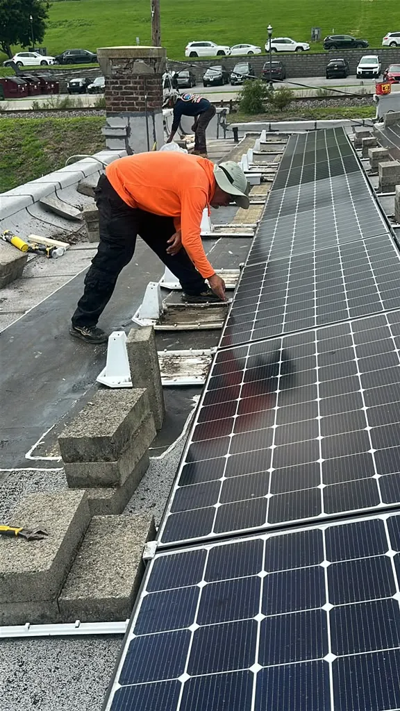 Commercial flat roof work around solar panels