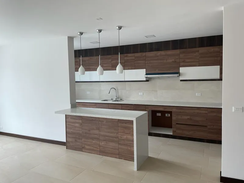 Modern kitchen with island and pendant lights