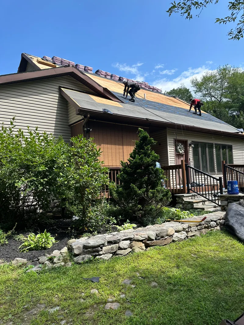 Our crew re-roofing a family home